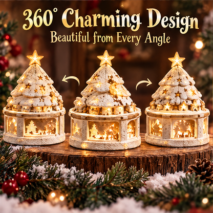 Close-up of snowy tree branches, a glowing star topper, gold-tone accents and little animal figures.